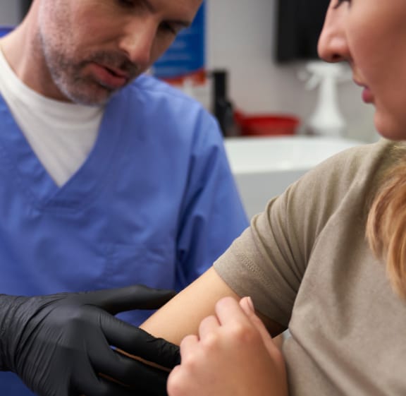Clinician examining a patient