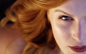 Close-up of woman with red hair