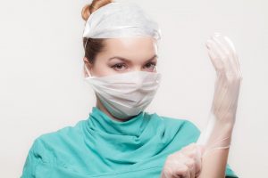 Woman preparing to perform surgery