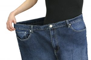 a Slim woman wearing oversized jeans